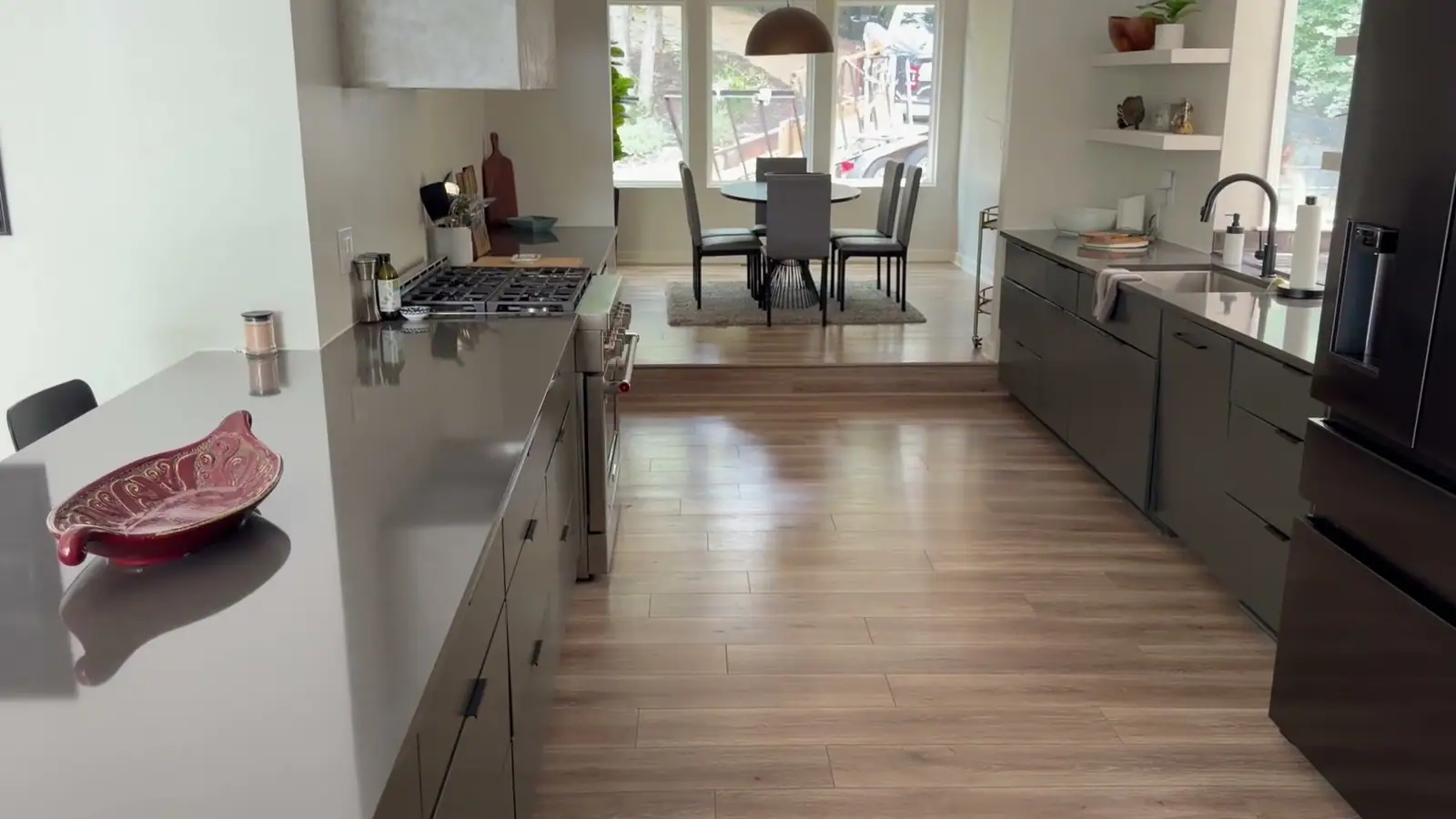Long view of a finished kitchen with charcoal countertops